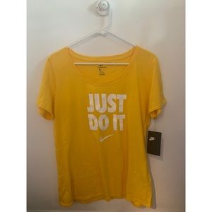 yellow Nike short sleeved shirt